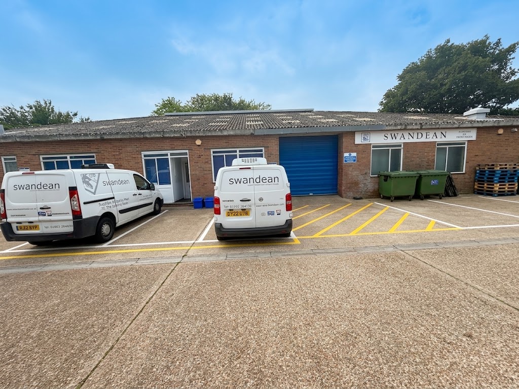 The Swandean premises in Worthing with two branded delivery vans parked outside
